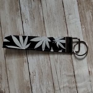 Glow in the dark cannabis key chain